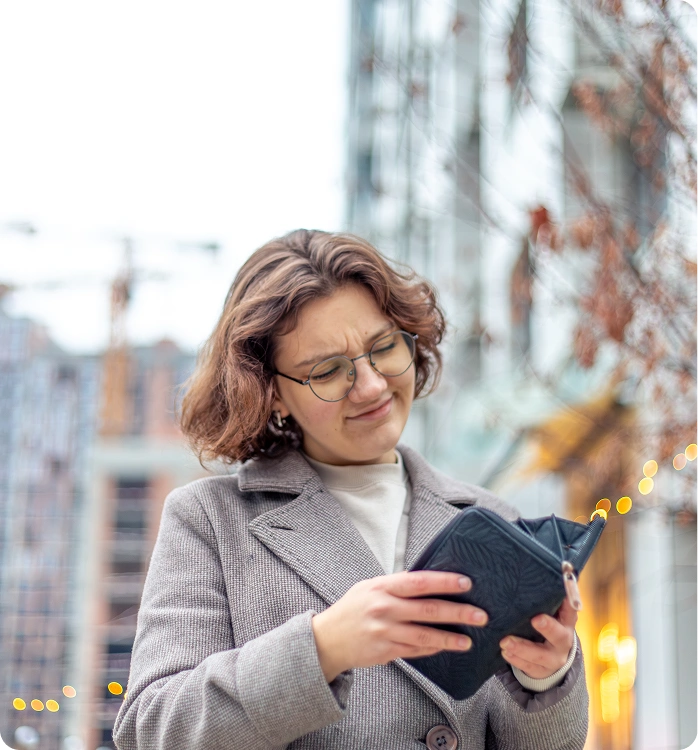 Woman looking at her wallet